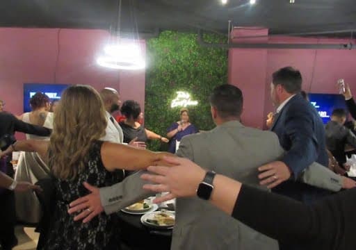Beacon of Hope supporters gathering together at a community event.