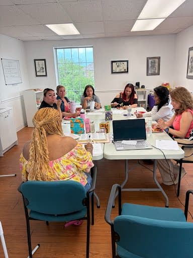 Community members gathered around a table during a Beacon of Hope workshop.